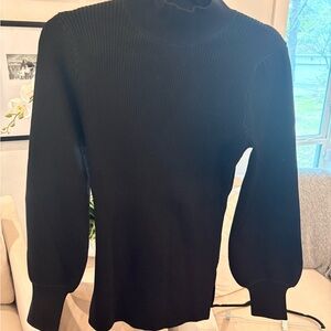 Hill House black ribbed mock-neck sweater with puff sleeves